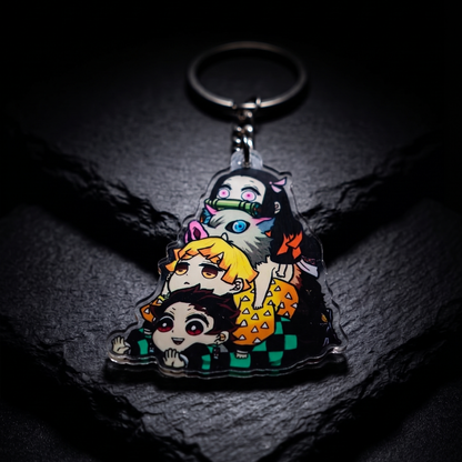 Dramatic spotlight on a Demon Slayer chibi squad acrylic keychain against a dark textured stone background