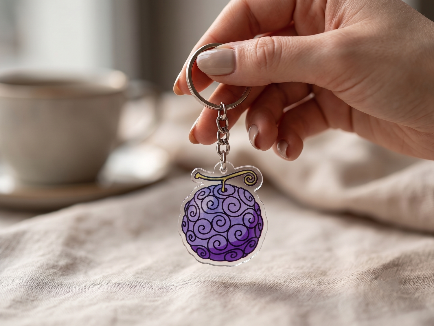 Gomu Gomu no Mi Devil Fruit acrylic keychain from One Piece held in hand