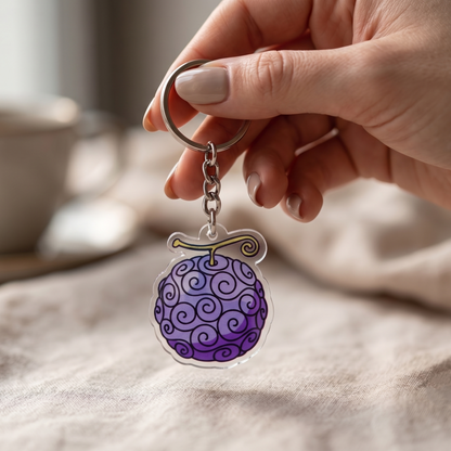 Gomu Gomu no Mi Devil Fruit acrylic keychain from One Piece held in hand