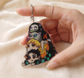 Demon Slayer chibi acrylic keychain featuring Tanjiro, Nezuko, Zenitsu and Inosuke - Devbu Store