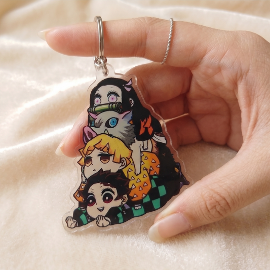 Demon Slayer chibi acrylic keychain featuring Tanjiro, Nezuko, Zenitsu and Inosuke - Devbu Store